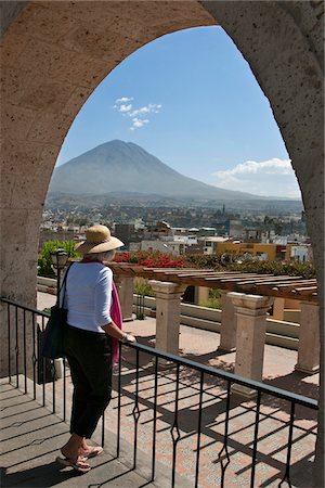 Peru, A tourist looks out over Arequipa to El Misti volcano from Yanahuara s  mirador  (scenic outlook). Stock Photo - Rights-Managed, Code: 862-03732142