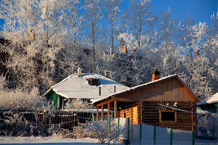 simsearch:862-03713335,k - Russia; Siberia; Irkutsk; Wooden houses covered in snow surrounded by trees covered by frost in Siberia's extreme temperatures Stock Photo - Rights-Managed, Code: 862-03732157