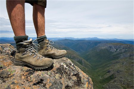 Australia, Tasmania, Cradle Mountain-Lake St Clair National Park.   Hiker standing on the summit of Cradle Mountain. Stock Photo - Rights-Managed, Code: 862-03807274