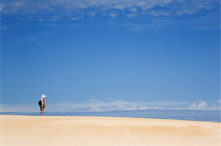 simsearch:862-03288987,k - Australia, Tasmania, Strahan.  A hiker looks out over Henty Dunes - a desert-like expanse of coastal sand dunes near Strahan. Stock Photo - Rights-Managed, Code: 862-03807271