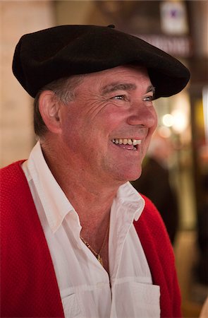 revelation - France, Haute-Garonne, Revel.  Cheese seller in traditional French beret, Revel market. Stock Photo - Rights-Managed, Code: 862-03807455