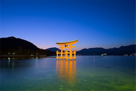 Asia, Japan, Honshu, Hiroshima prefecture, Miyajima Island, Floating torii gate illuminated at dusk Stock Photo - Rights-Managed, Code: 862-03807642