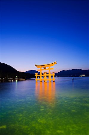 Asia, Japan, Honshu, Hiroshima prefecture, Miyajima Island, Floating torii gate illuminated at dusk Stock Photo - Rights-Managed, Code: 862-03807643