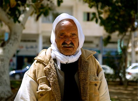 photos of old arab men - Misrata, Libya; Suleyman, speaking the standard Arabic apart from English and Italian (quite a rarity nowadays), showing an influence by past rulers of the country, vividly spoke about Misrata in the past Stock Photo - Rights-Managed, Code: 862-03807855