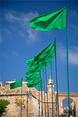 Tripoli, Libya; Libyan flags prominently displayed on Green Square in front of the entrance to the old Medina of Tripoli Stock Photo - Rights-Managed, Code: 862-03807883