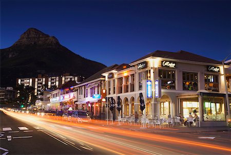 simsearch:862-03808521,k - Traffic light trails passing restaurants on Victoria Road, Camps Bay, Cape Town, Western Cape, South Africa Foto de stock - Con derechos protegidos, Código: 862-03808342