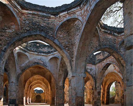 The magnificent ruins of the Great Mosque at Kilwa Kisiwani which was first built in the 10th and 11th centuries with important additions in the 14th century. By the 16th century, it had become the largest mosque south of the Sahara. Stock Photo - Rights-Managed, Code: 862-03808682