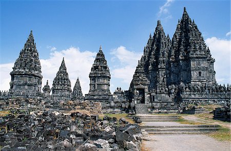 Prambanan temple complex, Java, Indonesia.Just about 10 miles outside of Yogyakarta in central Java is the temple complex of Prambanan.This huge complex of Hindu temples was constructed between the 8th and 10th centuries. Stock Photo - Rights-Managed, Code: 862-03820590