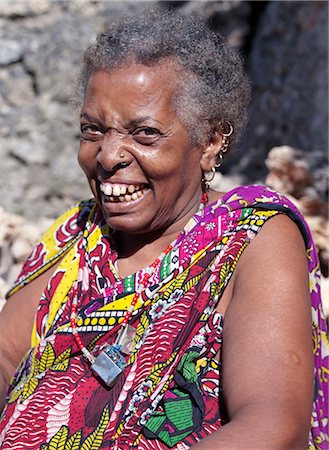 simsearch:862-03820754,k - A Swahili woman of Pate Island wears vipete gold earrings that were widely worn in Pate Village as a manifestation of a persons wealth. They are very rarely seen today. Gold rings in a womans nose are also ornaments that are no longer in fashion.Pate was established by Arabs from Arabia in the 13th century, or possibly earlier. Stock Photo - Rights-Managed, Code: 862-03820757