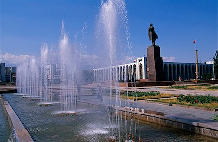 Kyrgyzstan, Bishkek.Statue of Lenin in Ala too Square.Originally, Bishkek was called Pishpek.In 1926, Pishpek became the capital of the Kirghiz Autonomous Republic.In 1936, as the capital of the Kirghiz Soviet Socialist Republic, Pishpek was renamed Frunze in honor of a major political organizer of the Civil War era. Stock Photo - Rights-Managed, Code: 862-03820796