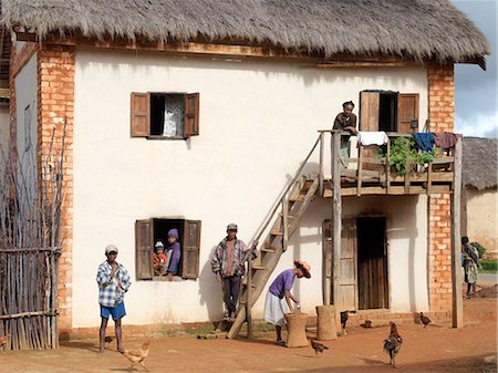 simsearch:862-03820754,k - An attractive Malagasy home of the Betsileo people who live southwest of the capital, Antananarivo.Most houses built by the Betsileo are double storied with kitchens and living quarters located on the first floor.Livestock is often kept in the ground floor of a house overnight. Stock Photo - Rights-Managed, Code: 862-03820822