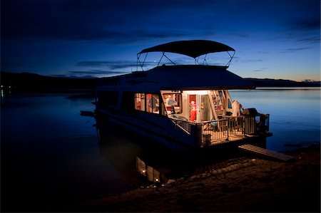 A houseboat on Shushwap Lake in the British Columbia interior, Canada Stock Photo - Rights-Managed, Code: 862-03887481