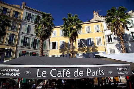 Marseille, Provence, France; A cafe amidst building and palm trees Stock Photo - Rights-Managed, Code: 862-03887775