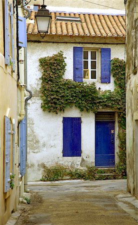 simsearch:862-07495900,k - Arles; Bouches du Rhone, France; Brightly coloured doors and windows on whitewashed houses Stock Photo - Rights-Managed, Code: 862-03887772