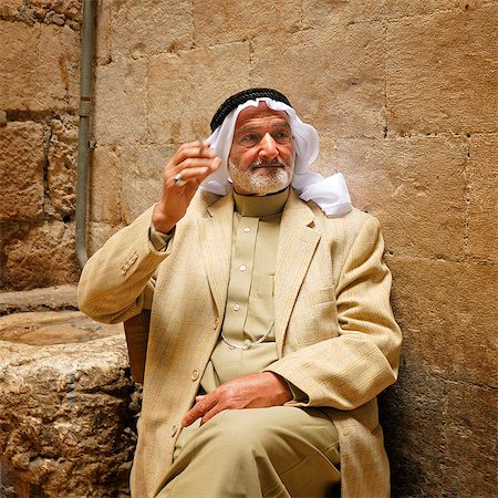 An arab in the old city smoking a cigarette. Jerusalem, Israel, Middle East Stock Photo - Rights-Managed, Code: 862-03888503