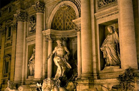 fontana - Rome, Italy; Detail of the Fontana di Trevi in the last evening light with the mighty figure of Oceanus, the god of the ocean on a shell shaped chariot in the middle with the statues of abundance and healing left and right respectively Stock Photo - Rights-Managed, Code: 862-03888633