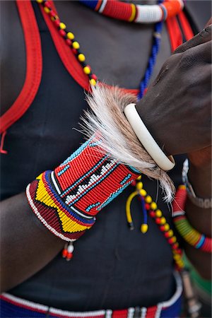 The ornaments of a Pokot warrior including a ring of goat skin which would have been slaughtered for a ceremony. The Pokot are pastoralists speaking a Southern Nilotic language. Fotografie stock - Rights-Managed, Codice: 862-03888698