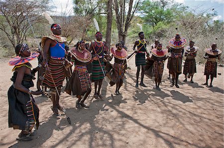 simsearch:862-03888689,k - Pokot men, women, boys and girls dancing to celebrate an Atelo ceremony. The Pokot are pastoralists speaking a Southern Nilotic language. Stock Photo - Rights-Managed, Code: 862-03888691