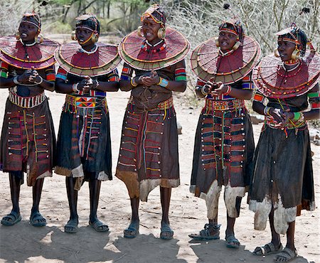 pokot ethnicity (female) - Pokot women wearing traditional beaded ornaments and brass earrings denoting their married status. celebrate an Atelo ceremony. The Pokot are pastoralists speaking a Southern Nilotic language. Stock Photo - Rights-Managed, Code: 862-03888693