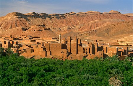 Morocco, Tamdaght, nr Ouarzazate. The Berber village of Tamdaght and its crumbling kasbahs nestle by the southern foothills of the High Atlas Mountains near Ait Benhaddou. Stock Photo - Rights-Managed, Code: 862-03888932