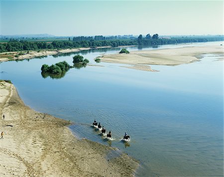 equestrian - A group of horsemen on the Tagus river, Santarem, Portugal Foto de stock - Con derechos protegidos, Código: 862-03889304