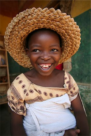 Rwanda. A young girl helps out at the Covega hyacinth weaving cooperative. Stock Photo - Rights-Managed, Code: 862-03889493