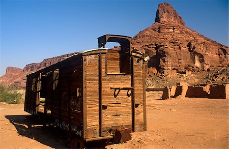 Saudi Arabia, Madinah, Al-Ula. Remnants of the famous Hejaz Railway, including this abandoned cargo wagon, litter the Al-Ula region. Stock Photo - Rights-Managed, Code: 862-03889522