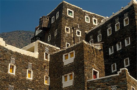 Saudi Arabia, Asir, Rejal- al-amaa. Standing in the Asir Mountains and recently part-restored, the village of Rejal al-Maa's traditional masonry buildings show similarities to the architecture of nearby Yemen. Foto de stock - Con derechos protegidos, Código: 862-03889532