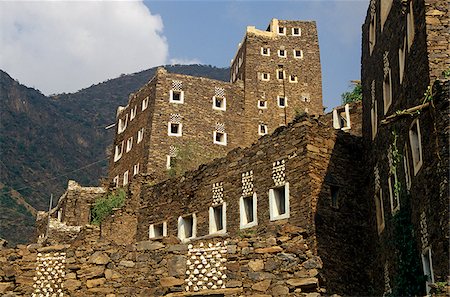 saudi arabia buildings - Saudi Arabia, Asir, Rejal- al-amaa. Standing in the Asir Mountains and recently part-restored, the village of Rejal al-Maa's traditional masonry buildings show similarities to the architecture of nearby Yemen. Foto de stock - Con derechos protegidos, Código: 862-03889533