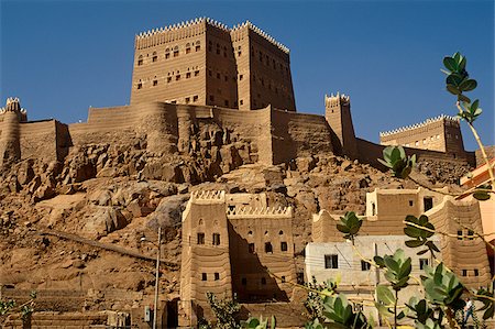 Saudi Arabia, Najran, Najran.  The privately-owned Al-Aan Palace, or Qasr al-Aan, with its adobe walls and white-washed crenellations and window frames bears a strong resemblance to the architecture of nearby Yemen. Stock Photo - Rights-Managed, Code: 862-03889544