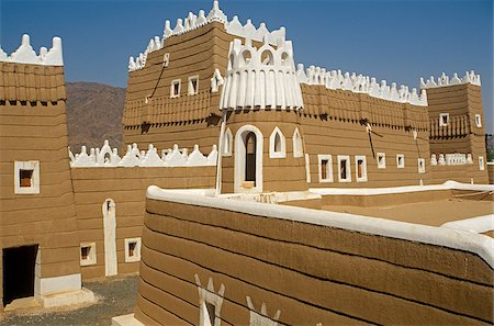 simsearch:862-03889538,k - Saudi Arabia, Najran, Najran. Built in the 1940s, Najran Fort, or Qasr al-Imara, with its adobe walls and white-washed crenellations and window frames bears a strong resemblance to the architecture of nearby Yemen. Stock Photo - Rights-Managed, Code: 862-03889540