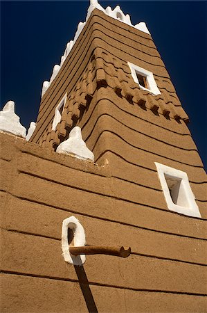 simsearch:862-03889538,k - Saudi Arabia, Najran, Najran. Built in the 1940s, Najran Fort, or Qasr al-Imara, with its adobe walls and white-washed crenellations and window frames bears a strong resemblance to the architecture of nearby Yemen. Stock Photo - Rights-Managed, Code: 862-03889541