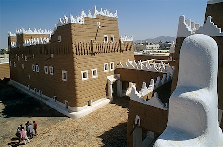 simsearch:862-03889538,k - Saudi Arabia, Najran, Najran. Built in the 1940s, Najran Fort, or Qasr al-Imara, with its adobe walls and white-washed crenellations and window frames bears a strong resemblance to the architecture of nearby Yemen. Stock Photo - Rights-Managed, Code: 862-03889542