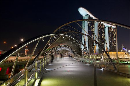 simsearch:862-07690833,k - Singapore, Singapore, Marina Bay.  The Helix Bridge and Marina Bay Sands Singapore.  The hotel complex includes a casino, shopping mall and the ArtScience Museum. Stock Photo - Rights-Managed, Code: 862-03889573