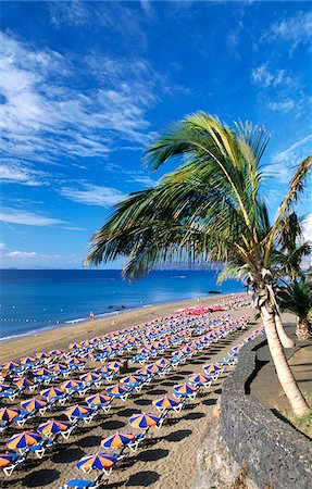 playa blanca - Playa Blanca in Puerto del Carmen, Lanzarote, Canary Islands, Spain Foto de stock - Con derechos protegidos, Código: 862-03889714