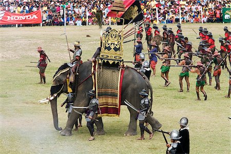 simsearch:855-02985793,k - Thailand, Surin, Surin.  Ancient war re-enactment in Srinarong Stadium during the Elephant Roundup festival.  The event held in November sees hundreds of elephants involved in a celebration of the region's proud elephant history and traditions. Foto de stock - Con derechos protegidos, Código: 862-03889851