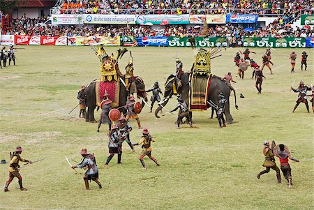 simsearch:862-03889813,k - Thailand, Surin, Surin.  Soldiers battle in an ancient war re-enactment during the Elephant Roundup festival.  The event held in November sees hundreds of elephants involved in a celebration of the region's proud elephant history and traditions. Stock Photo - Rights-Managed, Code: 862-03889852