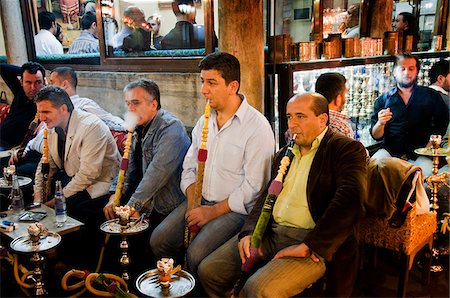 Men smoking nargileh and taking tea at Corlulu Alipasa Medresesi. Istanbul, Turkey Stock Photo - Rights-Managed, Code: 862-03889899