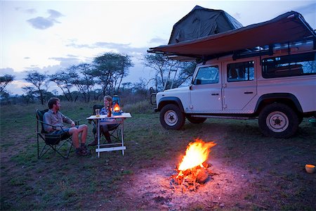 people by camp fire - Tanzania, Serengeti. Rough camping in one of the designated 'special campsites' (Sero 1 extra). Stock Photo - Rights-Managed, Code: 862-03890052