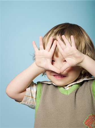 Little boy with hands covering face Stock Photo - Rights-Managed, Code: 877-06834041