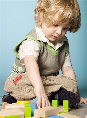 Little boy playing with wooden blocks Stock Photo - Rights-Managed, Code: 877-06834042