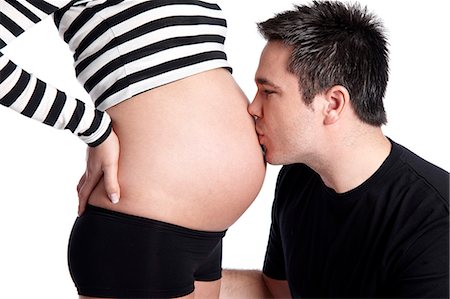 simsearch:877-06834255,k - Man kissing stomach of pregnant woman Foto de stock - Con derechos protegidos, Código: 877-06834269