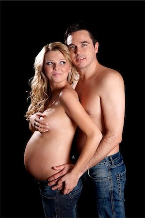 people standing white backgrounds - Man embracing topless pregnant woman Stock Photo - Rights-Managed, Code: 877-06834260