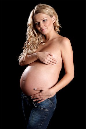 pregnant woman standing white background - Topless pregnant woman with hands covering breast Stock Photo - Rights-Managed, Code: 877-06834279