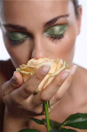 smelling hair - Young woman smelling rose Stock Photo - Rights-Managed, Code: 877-06834722