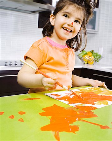 Little girl painting Stock Photo - Rights-Managed, Code: 877-06834779