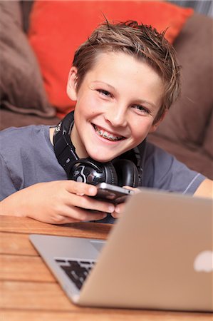 smile teeth - France, young boy with a computer Stock Photo - Rights-Managed, Code: 877-06835801