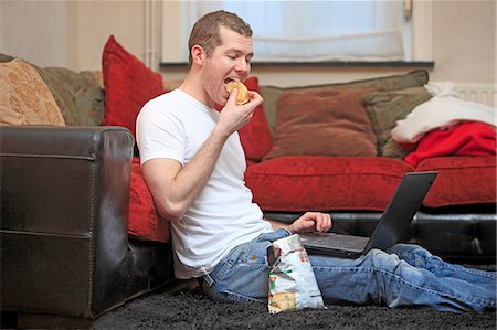 simsearch:877-06835867,k - France man at home eating chips. Stock Photo - Rights-Managed, Code: 877-06835870