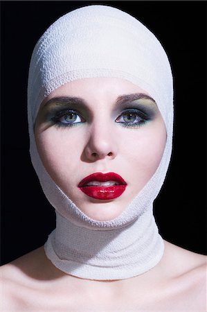 simsearch:877-06836244,k - Young woman with bandages on head Fotografie stock - Rights-Managed, Codice: 877-06836220