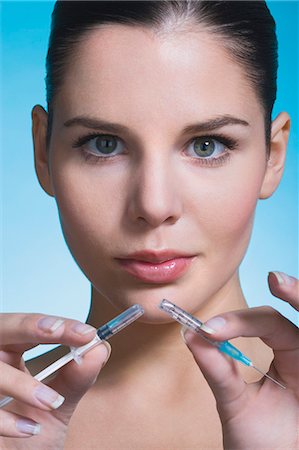 syringe woman face - Young woman with broken syringe Stock Photo - Rights-Managed, Code: 877-06836286